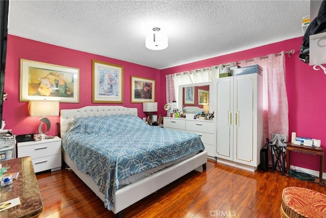 2011 W Katella Ave Unit 17, Anaheim, CA 92804 - bedroom featuring wood finished floors and a textured ceiling