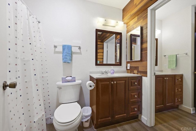 5938 Rancho Mission Rd Unit 133, San Diego, CA 92108 - full bathroom featuring wood finished floors, vanity, toilet, and a shower with shower curtain