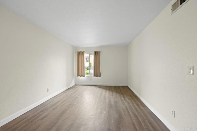 5938 Rancho Mission Rd Unit 133, San Diego, CA 92108 - empty room with wood finished floors and baseboards