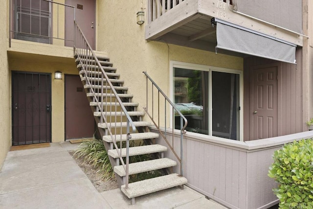 5938 Rancho Mission Rd Unit 133, San Diego, CA 92108 - property entrance featuring stucco siding and a balcony