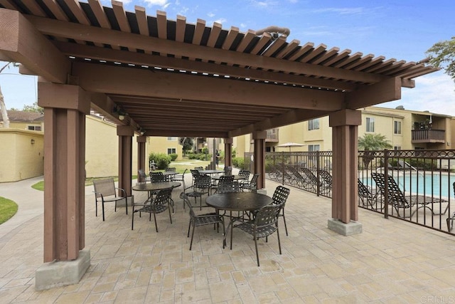 5938 Rancho Mission Rd Unit 133, San Diego, CA 92108 - view of patio featuring a community pool, outdoor dining space, and a pergola