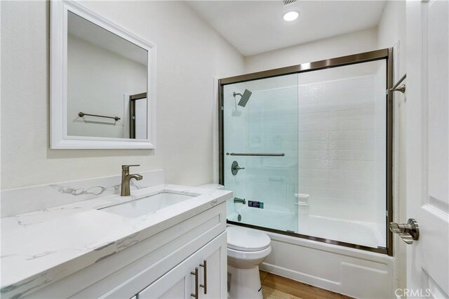 4071 Melrose Ave Unit 1, Los Angeles, CA 90029 - bathroom featuring vanity, shower / bath combination with glass door, and wood finished floors