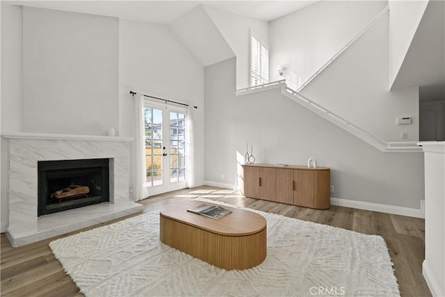 1202 Monte Sereno Dr, Thousand Oaks, CA 91360 - living area with high vaulted ceiling, baseboards, a fireplace, and wood finished floors