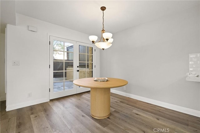 1202 Monte Sereno Dr, Thousand Oaks, CA 91360 - dining space featuring a chandelier, wood finished floors, and baseboards