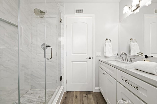1202 Monte Sereno Dr, Thousand Oaks, CA 91360 - bathroom featuring vanity, wood finished floors, and a marble finish shower