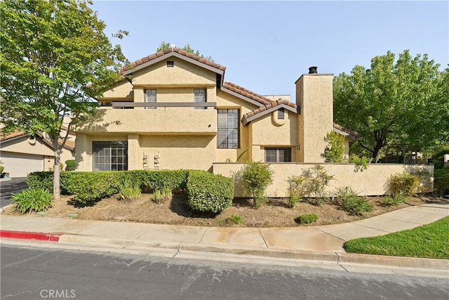 1202 Monte Sereno Dr, Thousand Oaks, CA 91360 - view of front of property with stucco siding, a chimney, and a tiled roof