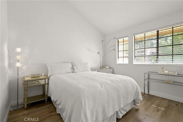 1202 Monte Sereno Dr, Thousand Oaks, CA 91360 - bedroom with multiple windows, wood finished floors, vaulted ceiling, and baseboards