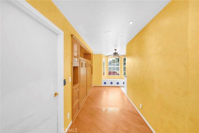 12071 Reva Dr, Garden Grove, CA 92840 - corridor featuring light wood-style floors and baseboards
