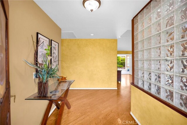 12071 Reva Dr, Garden Grove, CA 92840 - hall featuring wood finished floors and baseboards