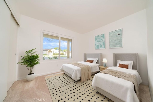 837 Ardmore Cir, Redlands, CA 92374 - bedroom with light carpet, baseboards, and a closet