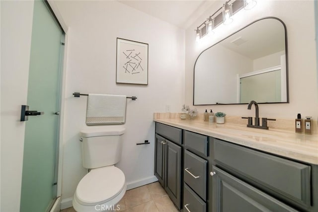 837 Ardmore Cir, Redlands, CA 92374 - bathroom with vanity, toilet, an enclosed shower, tile patterned flooring, and baseboards