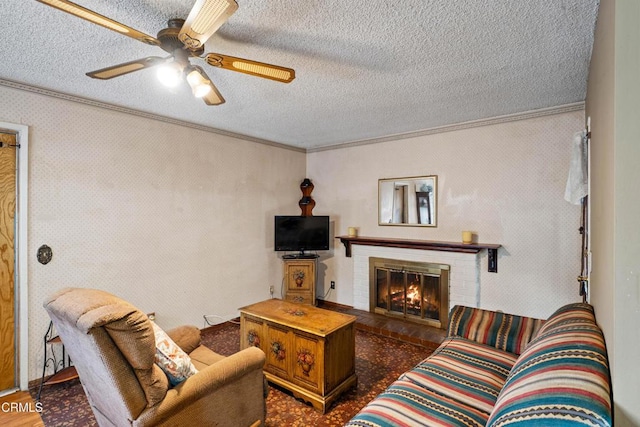 4320 Hamilton Ave, Oxnard, CA 93033 - living area featuring ornamental molding, a textured ceiling, ceiling fan, a fireplace, and dark wood finished floors