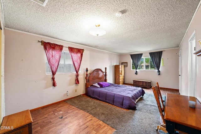 4320 Hamilton Ave, Oxnard, CA 93033 - bedroom featuring wood finished floors, a textured ceiling, and ornamental molding