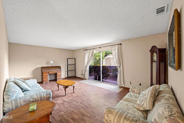 4320 Hamilton Ave, Oxnard, CA 93033 - living area with a textured ceiling and wood finished floors