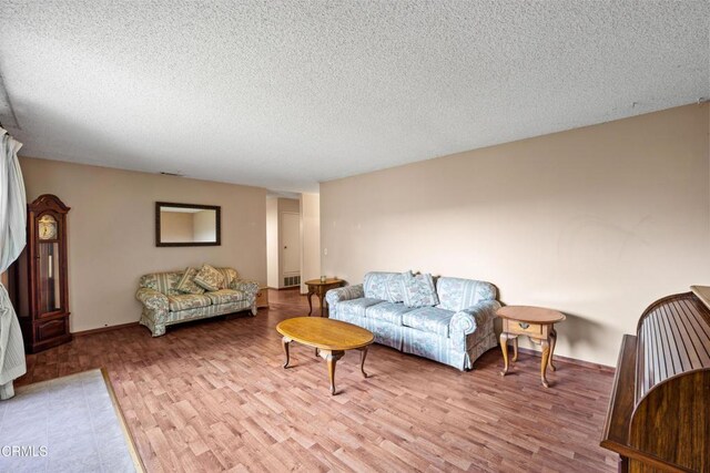 4320 Hamilton Ave, Oxnard, CA 93033 - living area featuring wood finished floors and a textured ceiling