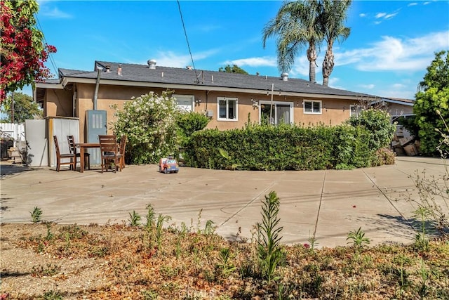 8214 Klusman Ave, Rancho Cucamonga, CA 91730 - rear view of property with stucco siding and a patio area