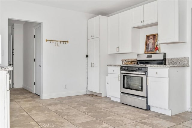 8214 Klusman Ave, Rancho Cucamonga, CA 91730 - kitchen featuring stainless steel range with gas cooktop, white cabinetry, and light stone counters