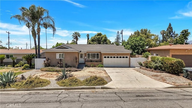 8214 Klusman Ave, Rancho Cucamonga, CA 91730 - ranch-style house with a garage, stucco siding, and driveway