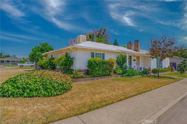 1640 Shirley St, Merced, CA 95341 - single story home featuring a chimney, a front lawn, stucco siding, a porch, and central air condition unit