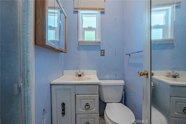 1640 Shirley St, Merced, CA 95341 - full bathroom with vanity, toilet, and plenty of natural light