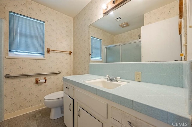 1640 Shirley St, Merced, CA 95341 - full bath featuring wallpapered walls, vanity, toilet, a stall shower, and healthy amount of natural light