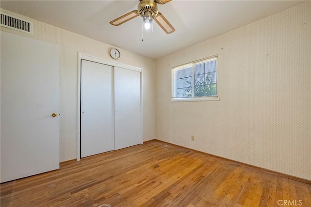 1640 Shirley St, Merced, CA 95341 - unfurnished bedroom featuring light wood-type flooring, a closet, and a ceiling fan