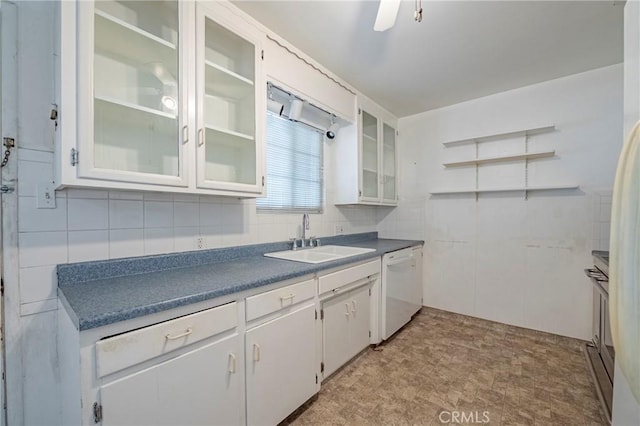1640 Shirley St, Merced, CA 95341 - kitchen with a sink, dishwasher, backsplash, white cabinetry, and dark countertops