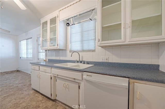 1640 Shirley St, Merced, CA 95341 - kitchen featuring white dishwasher, a sink, decorative backsplash, and dark countertops