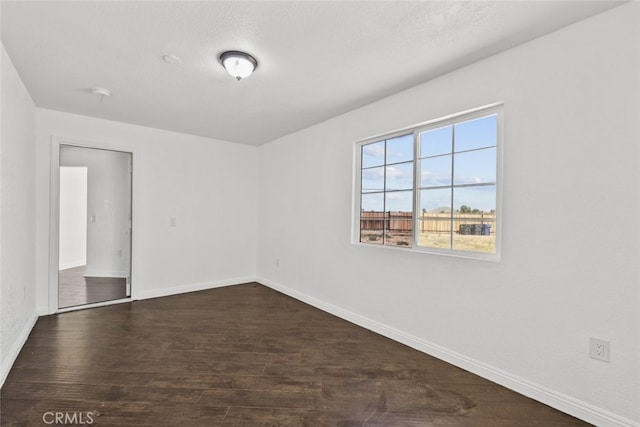 18531 E Palmdale Blvd, Palmdale, CA 93591 - empty room with baseboards and dark wood-style flooring