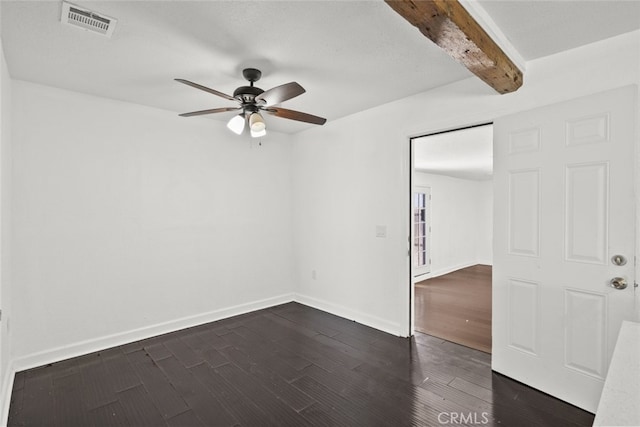 18531 E Palmdale Blvd, Palmdale, CA 93591 - unfurnished room featuring a ceiling fan, beamed ceiling, dark wood-type flooring, and baseboards