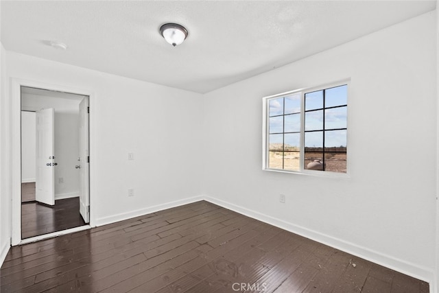 18531 E Palmdale Blvd, Palmdale, CA 93591 - empty room with baseboards and dark wood finished floors