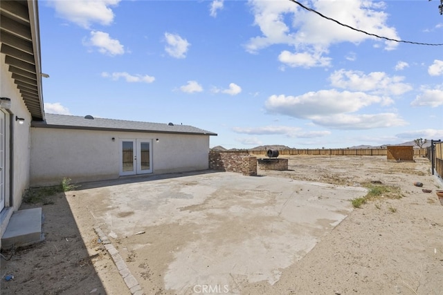 18531 E Palmdale Blvd, Palmdale, CA 93591 - fenced backyard featuring french doors and a patio area
