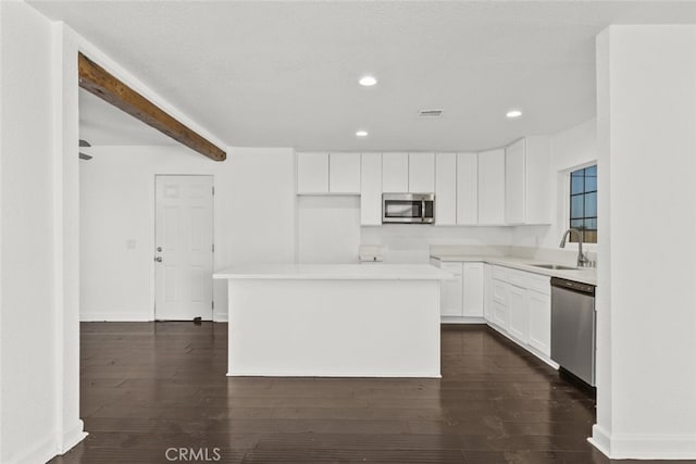18531 E Palmdale Blvd, Palmdale, CA 93591 - kitchen with stainless steel appliances, a sink, white cabinetry, recessed lighting, and a center island