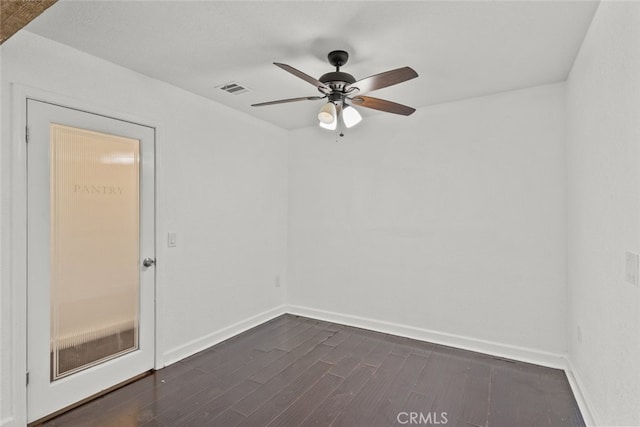 18531 E Palmdale Blvd, Palmdale, CA 93591 - spare room with dark wood-style floors, baseboards, and a ceiling fan