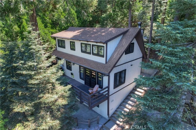 28545 Wabash Dr, Lake Arrowhead, CA 92352 - view of front of home featuring a shingled roof and a wooded view