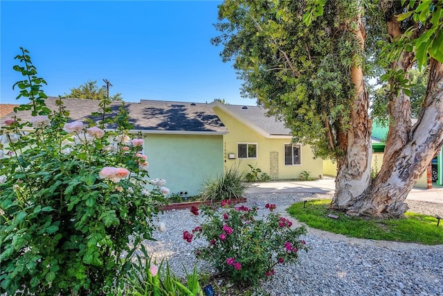 17508 Strathern St, Northridge, CA 91325 - view of front facade featuring stucco siding and roof with shingles