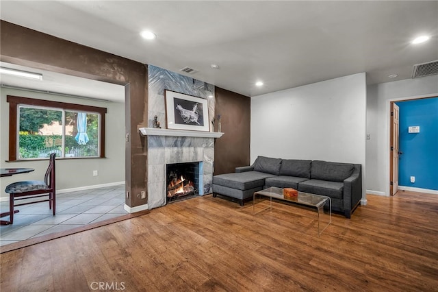 17508 Strathern St, Northridge, CA 91325 - living area with wood finished floors, baseboards, a fireplace, and recessed lighting