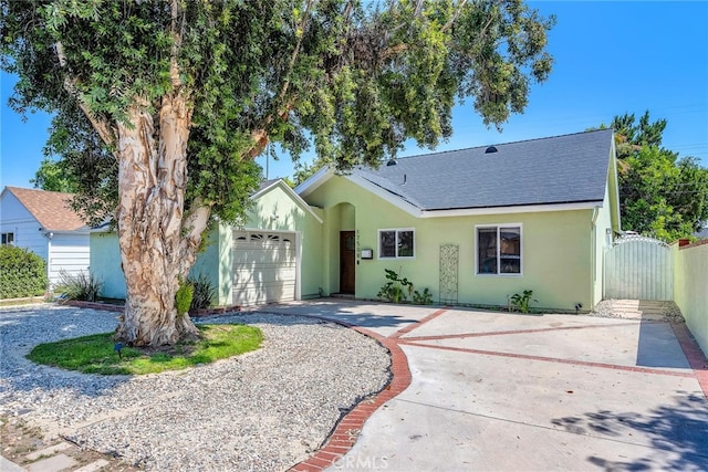 17508 Strathern St, Northridge, CA 91325 - single story home featuring roof with shingles, an attached garage, stucco siding, a gate, and driveway