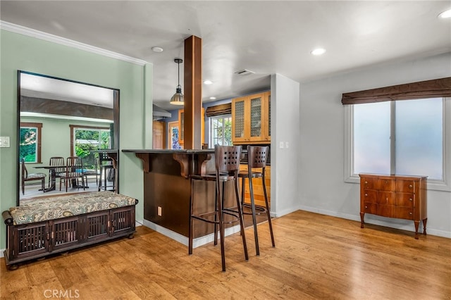 17508 Strathern St, Northridge, CA 91325 - kitchen with wood finished floors, baseboards, recessed lighting, a breakfast bar, and pendant lighting