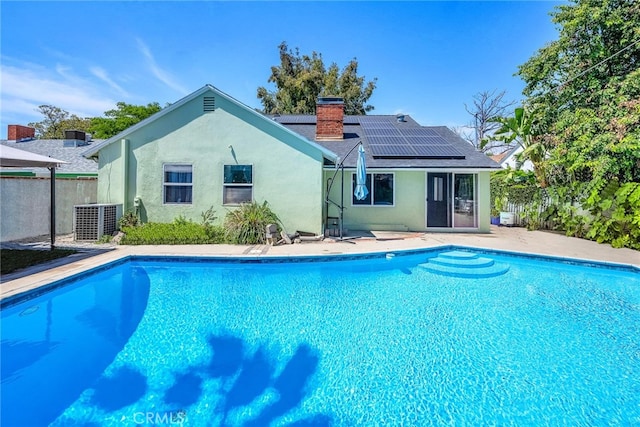 17508 Strathern St, Northridge, CA 91325 - view of swimming pool featuring central AC unit and a patio