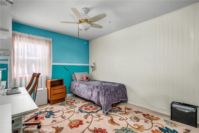 17508 Strathern St, Northridge, CA 91325 - bedroom featuring a ceiling fan, wood walls, and baseboards