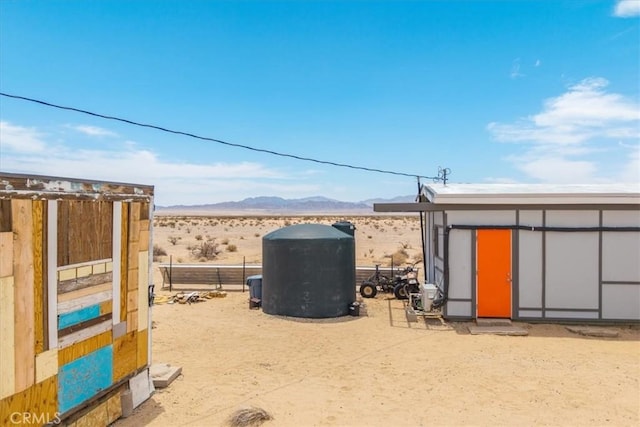 84951 Amboy Rd Unit 29, Palms, CA 92277 - view of yard featuring a mountain view and view of desert landscape