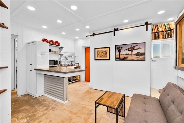 84951 Amboy Rd Unit 29, Palms, CA 92277 - living area featuring a barn door, concrete flooring, and recessed lighting