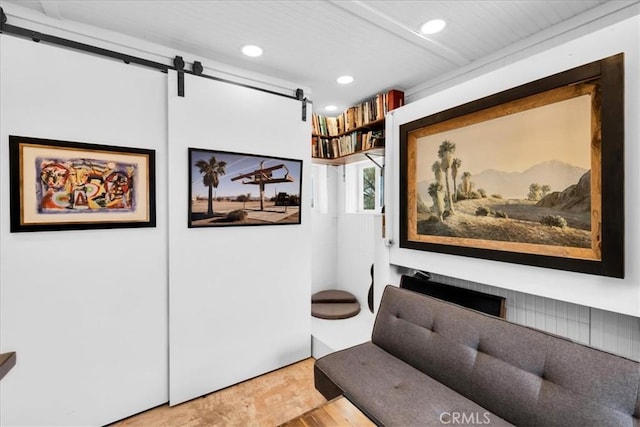84951 Amboy Rd Unit 29, Palms, CA 92277 - living area with a barn door, recessed lighting, and wood finished floors