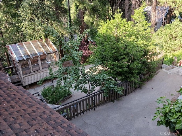 23304 Crest Forest Dr, Crestline, CA 92325 - view of patio featuring a greenhouse and an outdoor structure