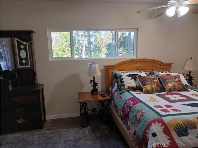 23304 Crest Forest Dr, Crestline, CA 92325 - bedroom featuring multiple windows, baseboards, wood finished floors, and ceiling fan