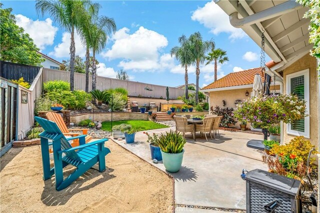 31141 Via Gilberto, Temecula, CA 92592 - fenced backyard featuring a patio and outdoor dining space