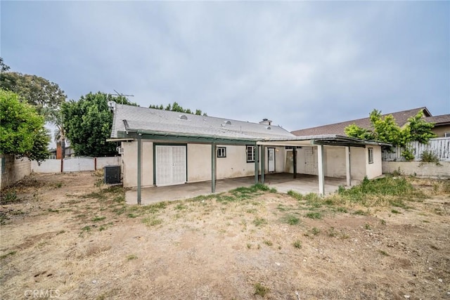 4496 Lyon Ave, Riverside, CA 92505 - rear view of house featuring a patio, a fenced backyard, central air condition unit, and stucco siding