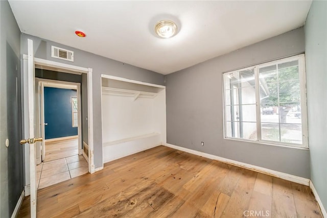 4496 Lyon Ave, Riverside, CA 92505 - unfurnished bedroom featuring hardwood / wood-style flooring, a closet, and baseboards