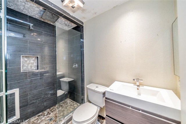 4496 Lyon Ave, Riverside, CA 92505 - bathroom featuring toilet, vanity, and tiled shower